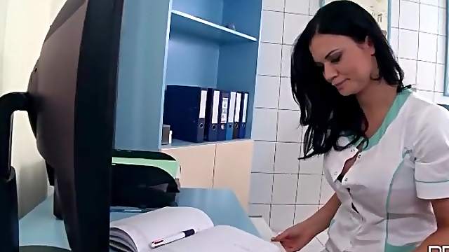 Nurse Emma Leigh fools around with lusty lesbian