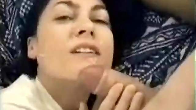 Cock is stroked until it explodes on her face