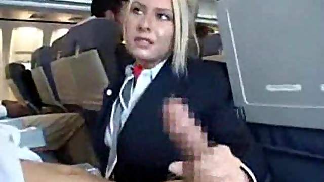 Stewardess sucking cock on a plane