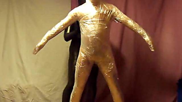 Man is wrapped in plastic entirely
