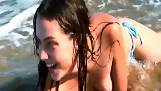 Cute girl fingers deeply at nude beach